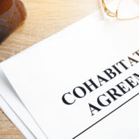 Cohabitation Agreement and books on a table