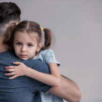 Child hugging her dad