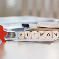 word alimony composed in block letters