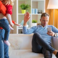 Young couple having difficulties at parenting together