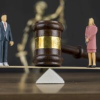 Divorce Concept , Gavel , Seesaw Scales , Woman and Man