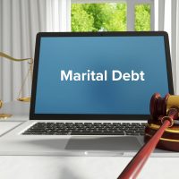 Marital Debt – Law, Judgment, Web. Laptop in the office