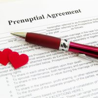 prenuptial agreement with two red hearts