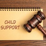 Notes Child support. Legal obligation for a non-custodial parent to provide financial assistance for their child's upbringing. Inscription and gavel. Law, rules and judgement