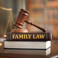 Family Law books on desk in law firm. Legal education about matrimonial law,law of domestic relations. Family Law books on desk in law firm. Legal education about matrimonial law,law of domestic relations.