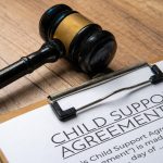A gavel on a child support agreement document. Legal concept.